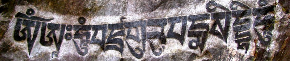 A Mani Stone in Nepal on which is carved "Om Mani Padme Om."