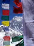 A view of Everest's summit through prayer flags