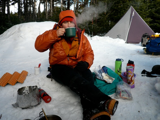 TA enjoying a hot drink after a night out in winter