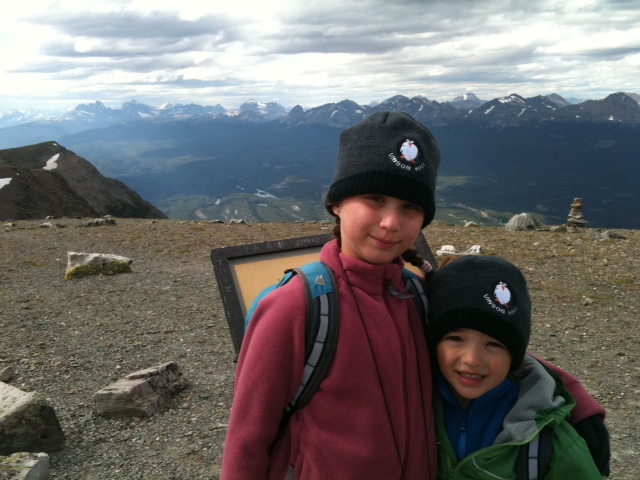 RayneXander pengion Rayne and Xander pose in their Mount Vinson Penguin toques on the summit of Mount Whistler