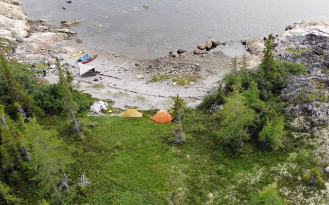 An overhead shot of tents and boats