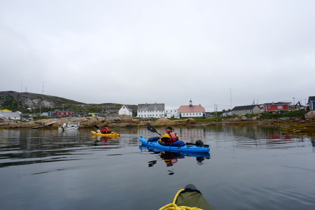 Paddlers entering Hopedale with historic mission in the background